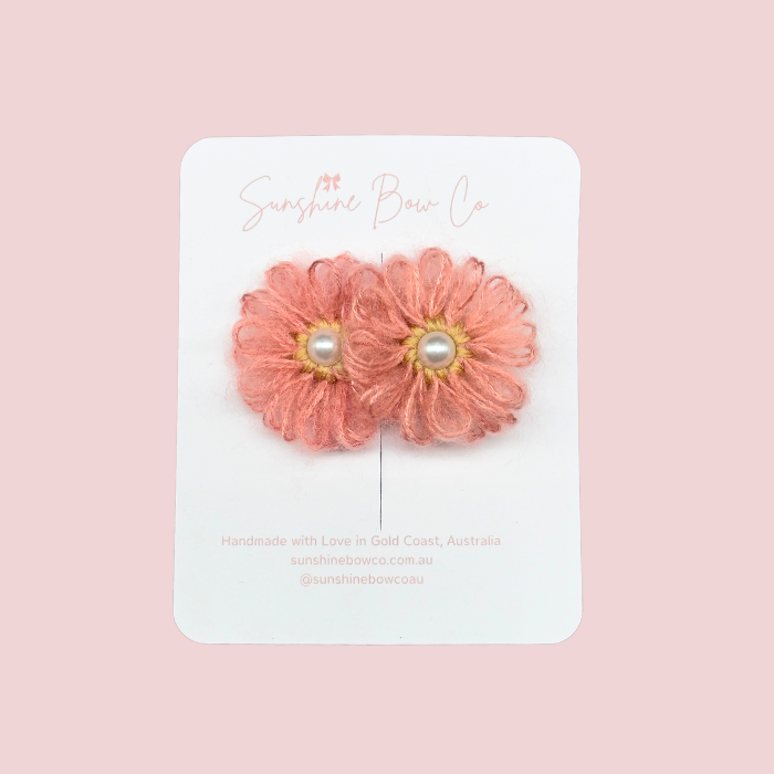 Pearl Bloom Rose hair clip, crafted from soft wool in a delicate flower design with a shimmering pearl center, measuring approximately 5 cm. Perfect for adding a touch of elegance to any hairstyle.