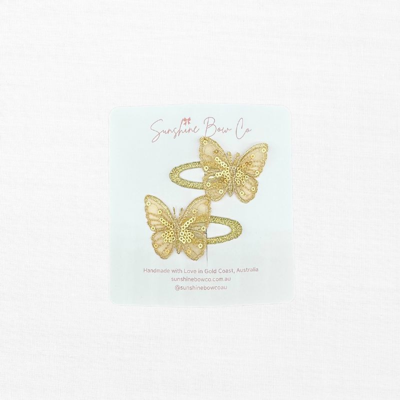 gold butterfly hair clips for girls.