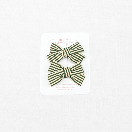 green strip pigtail bows.